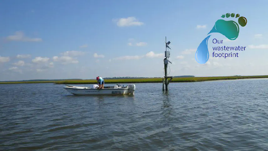 Boat on the water in the marsh with a waste water footprint logo